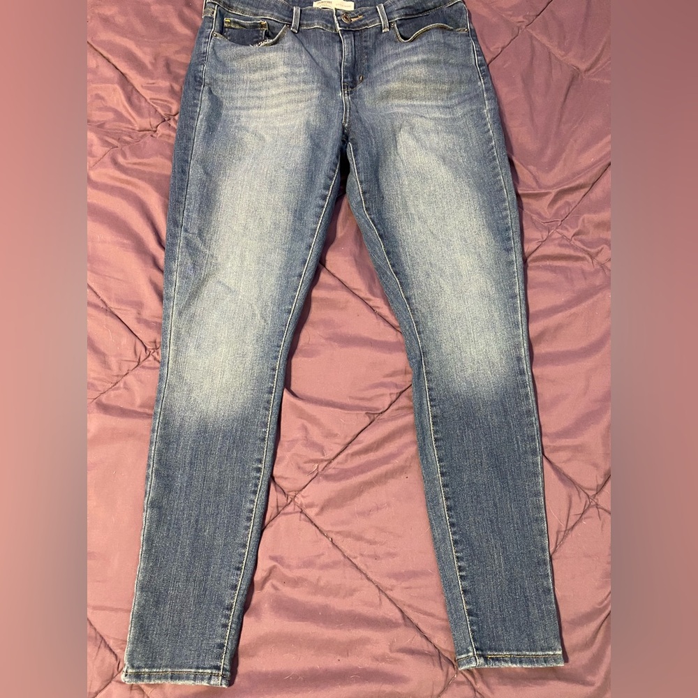 Levi's Blue Skinny Jeans with Tapered Leg and Distressed Details